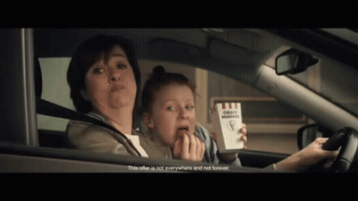 Woman Driving Car With Child Holding Box Of Gravy Mashed Potatoes GIF
