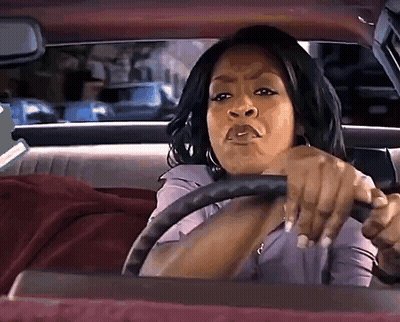 Woman Driving Car With Serious Look GIF