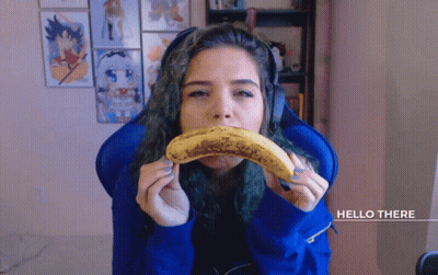 Woman Eating Banana Saying Hello There GIF