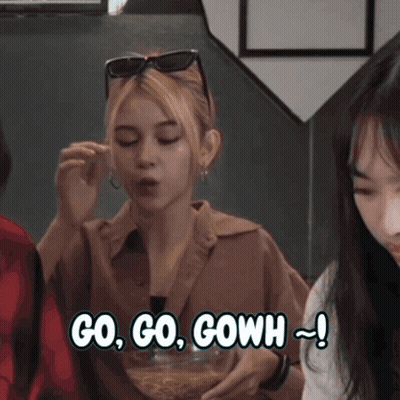 Woman Eating Bowl Of Food Saying Go Go Go GIF