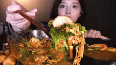 Woman Eating Bowl Of Food With Spoon GIF