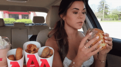 Woman Eating Burger King And Fries In Car GIF