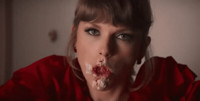 Woman Eating Cake With Icing On Mouth GIF