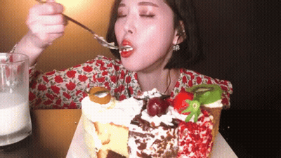 Woman Eating Cake With Spoon GIF