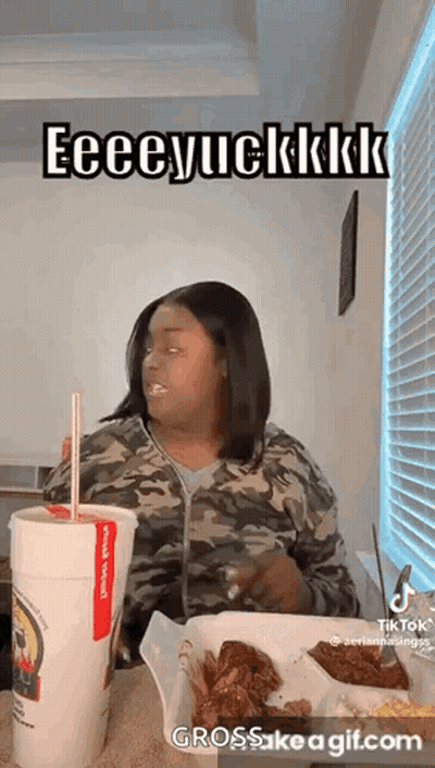Woman Eating Chicken Wings And Drinking GIF