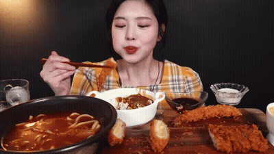 Woman Eating Curry With Chopsticks GIF