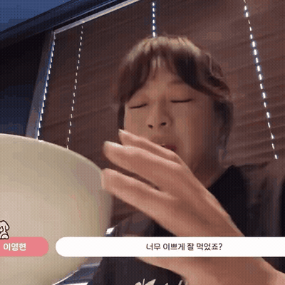 Woman Eating Food Eyes Closed At Blinds Window GIF