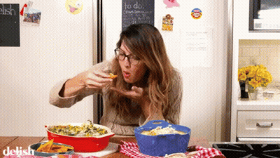 Woman Eating Food In Front Of Chalkboard Saying To Do GIF