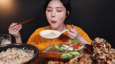 Woman Eating Food With Chopsticks GIF