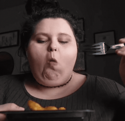 Woman Eating French Fries With Fork GIF