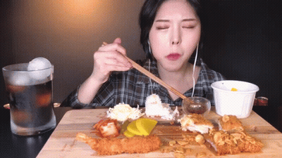 Woman Eating Fried Food With Chopsticks And Soda GIF