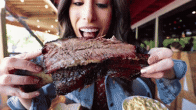 Woman Eating Huge Piece Of Meat GIF