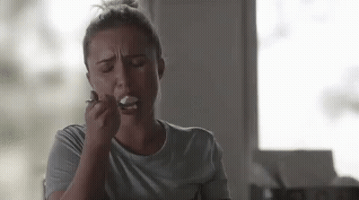 Woman Eating Ice Cream With Spoon GIF