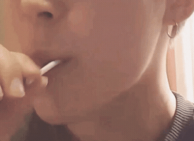 Woman Eating Lollipop GIF