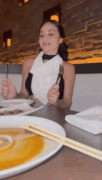 Woman Eating Meal With Chopsticks And Fork GIF