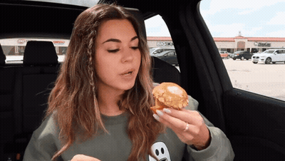 Woman Eating Muffin In Car Says Sissy Be Like Thanks Alot You Tasty Muffin Snake GIF