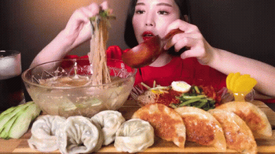 Woman Eating Noodles And Dumplings GIF