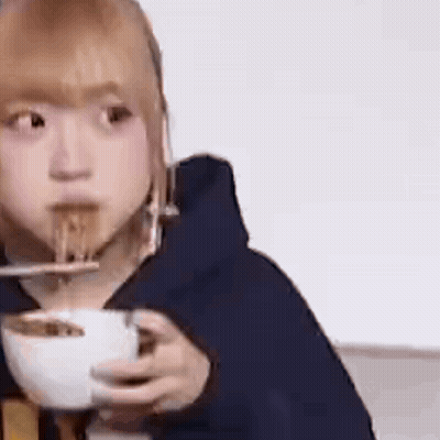 Woman Eating Noodles With Chopsticks GIF