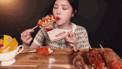 Woman Eating Pizza On A Stick GIF