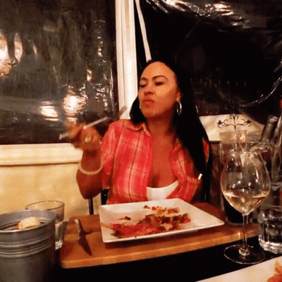 Woman Eating Plate Of Food GIF
