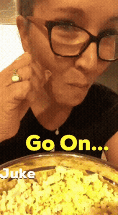 Woman Eating Popcorn Saying Go On Juke GIF