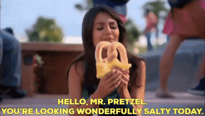 Woman Eating Pretzel Saying Hello Mr Pretzel GIF
