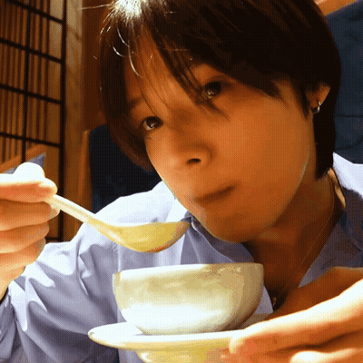 Woman Eating Something From Bowl With Spoon GIF