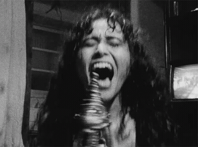 Woman Eating Stack Of Coins GIF