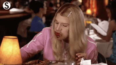 Woman Eating Steak At Restaurant Table GIF