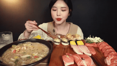 Woman Eating Sushi With Chopsticks GIF