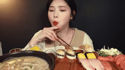 Woman Eating Sushi With Chopsticks And Soup GIF