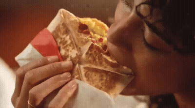 Woman Eating Taco With Red Ribbon GIF