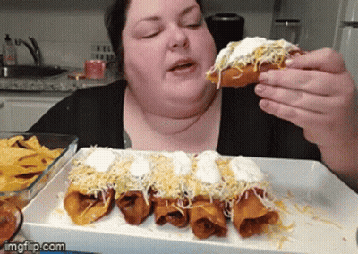 Woman Eating Taco With Sour Cream And Cheese GIF