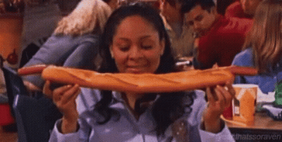 Woman Eating Very Long Loaf Of Bread GIF