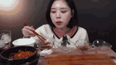 Woman Eating With Chopsticks GIF