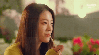 Woman Eating With Chopsticks In Restaurant GIF