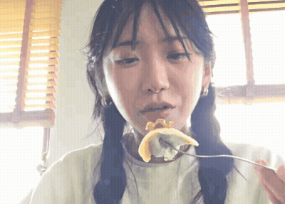 Woman Eating With Fork In Mouth GIF