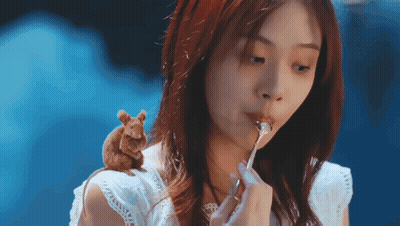 Woman Eating With Mouse On Shoulder GIF
