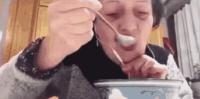 Woman Eating With Spoon And Chopsticks GIF