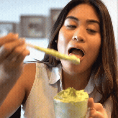 Woman Eating With Spoon In Mouth GIF