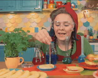Woman Elf Santa Doing Experiment GIF