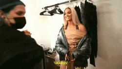 Woman Enjoys Sensible Chuckle In Dressing Room GIF