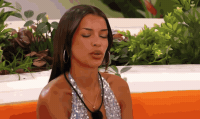Woman Eyes Closed Hoop Earrings Sequined Top GIF