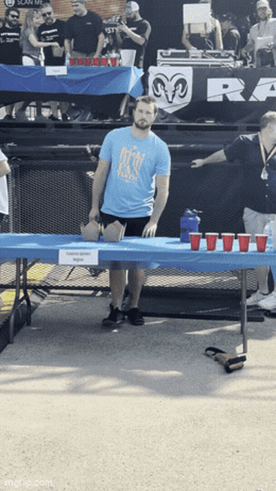 Woman Eyes Closed Hot Dog Thrown At Face GIF
