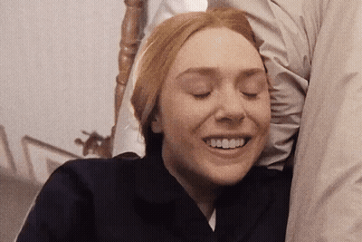 Woman Eyes Closed With Man's Arm Behind Her GIF
