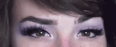 Woman Eyes With Purple Eye Shadow And Long Eyelashes GIF