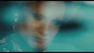 Woman Face Behind Blue Background GIF