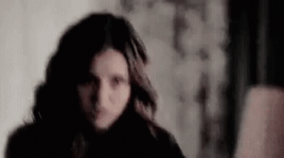 Woman Face Close Up In Dark Room GIF