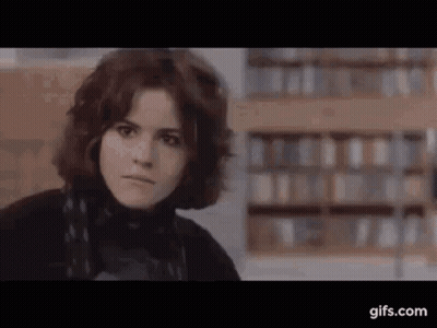 Woman Face Close Up In Library GIF