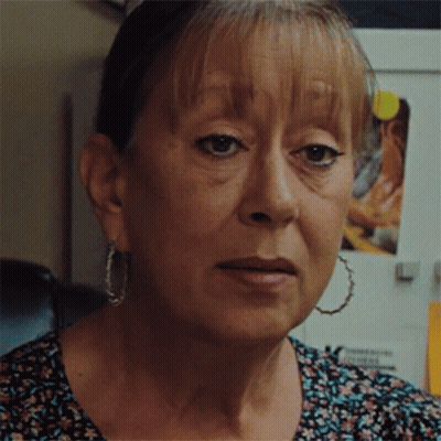 Woman Face Close Up With Hoop Earrings GIF